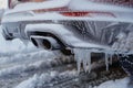 Winter freeze Frost coats the exhaust of a vehicle up close