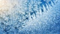 Winter frost patterns on glass. Ice crystals or cold winter background. Winter holidays season. Royalty Free Stock Photo