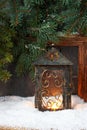Winter  frost window with burning lantern, Christmas  or Advent time Royalty Free Stock Photo