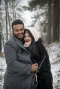 In winter, on a frosty day in the forest, a couple in love hugs Royalty Free Stock Photo