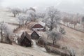 Winter frosty landscape of the beautiful Transylvanian village Royalty Free Stock Photo