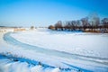 Winter frozen lake covered with ice and snow Royalty Free Stock Photo