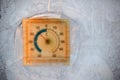 Winter frozen window pane and outdoor thermometer outside the window showing the low temperature on a cold winter day. Frost Royalty Free Stock Photo