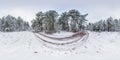 Winter full spherical hdri panorama 360 degrees angle view on dirt road in a snowy pinery forest with gray pale sky in