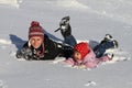 Happy family, mom and child, having fun in winter snow