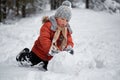 Winter fun. the boy sculpts the snowman.