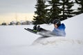 Winter Fun - Child Sledding/Tobogganing Fast Over Snow Ramp Royalty Free Stock Photo