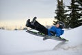 Winter Fun - Child Sledding/Tobogganing Fast Over Snow Ramp