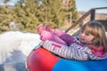 Winter fun in a inflatable tube Royalty Free Stock Photo