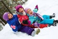 Winter fun, snow, children sledding at winter time Royalty Free Stock Photo