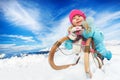 Winter fun in snow mountains girl on sledge Royalty Free Stock Photo