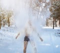 Winter fun and tempering procedures. Senior guy throwing snow on himself, developing resistance to cold at forest Royalty Free Stock Photo