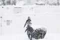 Winter Fun. Three teenagers play in the snowstorm in Lexington, MA on January 23, 2023