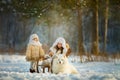Winter children portrait with samoyed dog