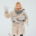 Winter Funny smiling woman portrait. Beautiful woman enjoying first snow. Winter funny woman with ice-skating. Happy