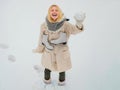 Winter funny woman with ice-skating. Outdoor photo of young beautiful happy smiling girl walking on white snow