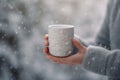 Winter gift design inspiration, girl holding white mug in close-up