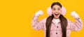 Winter girl. amazed kid in winter mittens and earmuffs on yellow background, winter fashion. Banner of christmas child Royalty Free Stock Photo