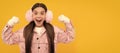 Winter girl. amazed kid in winter mittens and earmuffs on yellow background, winter fashion. Banner of christmas child Royalty Free Stock Photo