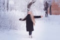 Winter girl blowing snow. Beauty Joyful Teenage Model Girl having fun in winter park. Beautiful girl laughing outdoors. Enjoying n Royalty Free Stock Photo