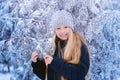 Winter girl blowing snow. Beauty Joyful Teenage Model Girl having fun in winter park. Beautiful girl laughing outdoors. Enjoying n Royalty Free Stock Photo