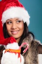 Winter girl santa helper hat holds red mug Royalty Free Stock Photo