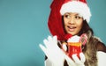 Winter girl santa helper hat holds red mug Royalty Free Stock Photo