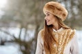 Winter girl smiling and looking at something. Copy space portrai Royalty Free Stock Photo