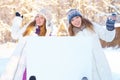 Winter. Girls with blank banner. Royalty Free Stock Photo