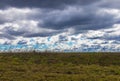 Winter Grassland Against Blue Winter Cloudy Sky Landscape Royalty Free Stock Photo