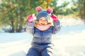 Winter happy smiling child playing with snow Royalty Free Stock Photo