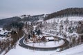 Winter in Harz Mountains National Park, Germany. Curved road and snow covered landscape Royalty Free Stock Photo