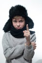 Winter hat with earflaps and scarf, portrait of a boy in winter clothes. Royalty Free Stock Photo