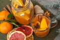 Winter healing ginger drink with lemon, honey and oranges.