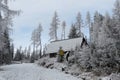 Romantic home covered by snow in the forest Royalty Free Stock Photo