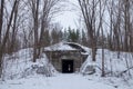 Winter. Hidden in the forest entrance to the secret soviet military bunker, echo of cold war