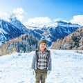 Happy girl in front of mountain landscape in Alto Adige, Italy