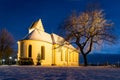 Old church illuminated at winter night Royalty Free Stock Photo