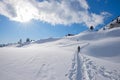 Winter hiker at mountain trail in snowy landscape Rofan, austrian alps Royalty Free Stock Photo