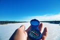 Winter hiking, explaining the ground with compass Royalty Free Stock Photo