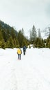 Winter hiking with friends in the mountains