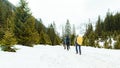 Winter hiking with friends in the mountains