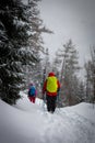 Winter hiking in the mountains on snowshoes with a backpack and tent Royalty Free Stock Photo