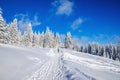 Winter hiking road in mountains with snow