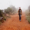 Winter, hiking and woman walking in nature for travel, wellness or morning break outdoor. Path, trekking and calm female Royalty Free Stock Photo