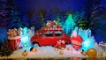 Diorama decorations of Christmas fairy tale Nutcracker with mini red car retro style in center. Winter holiday story backdrop. Royalty Free Stock Photo