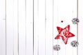 Winter holiday background with red star and snow painted pine co Royalty Free Stock Photo