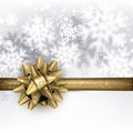 Winter holiday background with golden bow.