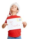 Winter holiday christmas concept - boy in hat with letter to santa on white isolated Royalty Free Stock Photo