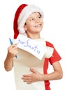 Winter holiday christmas concept - boy in hat with letter to santa on white isolated Royalty Free Stock Photo